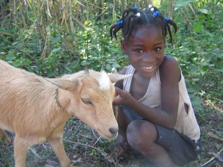 zchild with goat